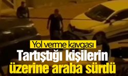 Tartıştığı kişilerin üzerine otomobil sürdü... O anlar kameraya yansıdı