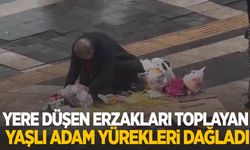 Yere düşen erzakları toplayan yaşlı adam yürekleri dağladı