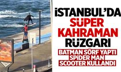 Bebek sahilinde ilginç anlar: Sörf yapan Batman ile scooter kullanan Spider Man bir arada!