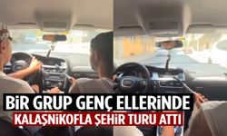 Bir grup genç ellerinde kalaşnikofla şehir turu attı!