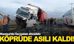 Manisa’da korkutan kaza… Tır köprünün korkuluklarında asılı kaldı!
