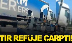 Manisa’da tır refüje çarptı... Tırdaki yük yola saçıldı