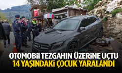 İzmir’de korku dolu anlar: Otomobil tezgahın üzerine uçtu!