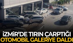 İzmir’de tırın çarptığı otomobil galeriye daldı