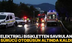 Elektrikli bisikletten savrulan sürücü otobüsün altında kaldı
