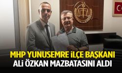 MHP Yunusemre İlçe Başkanı Ali Özkan mazbatasını aldı