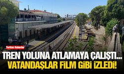 Tren yoluna atlamaya çalıştı... Vatandaşlar film gibi izledi!