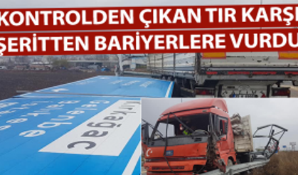 Yön levhasıyla trafik lambalarına çarpan TIR, karşı şeritte bariyerlere vurdu