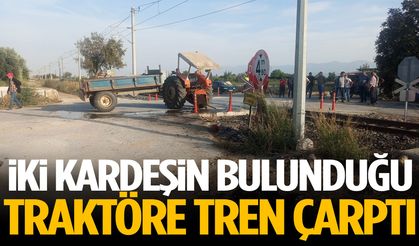 İki kardeşin bulunduğu traktöre tren çarptı