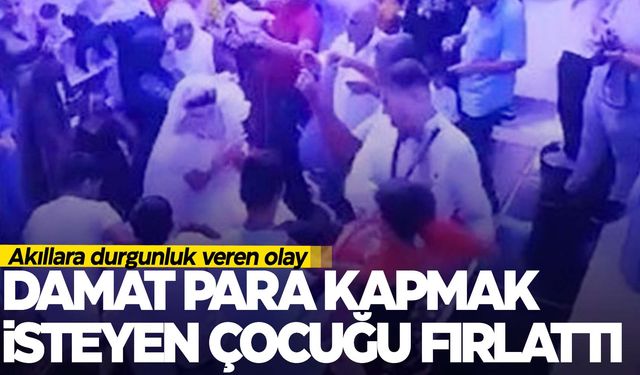 Düğünde gergin anlar… Damat para kapmak isteyen çocuğu fırlattı!