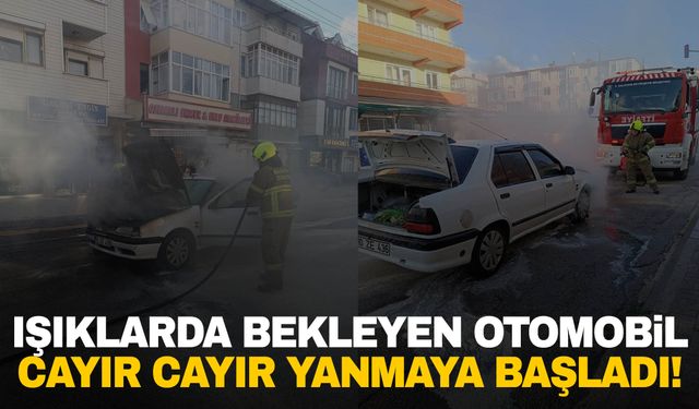 Trafik ışıklarında bekleyen otomobil alev aldı